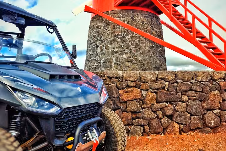 Experience Pico Island's rich heritage with a buggy tour past historic windmills and rugged stone walls.