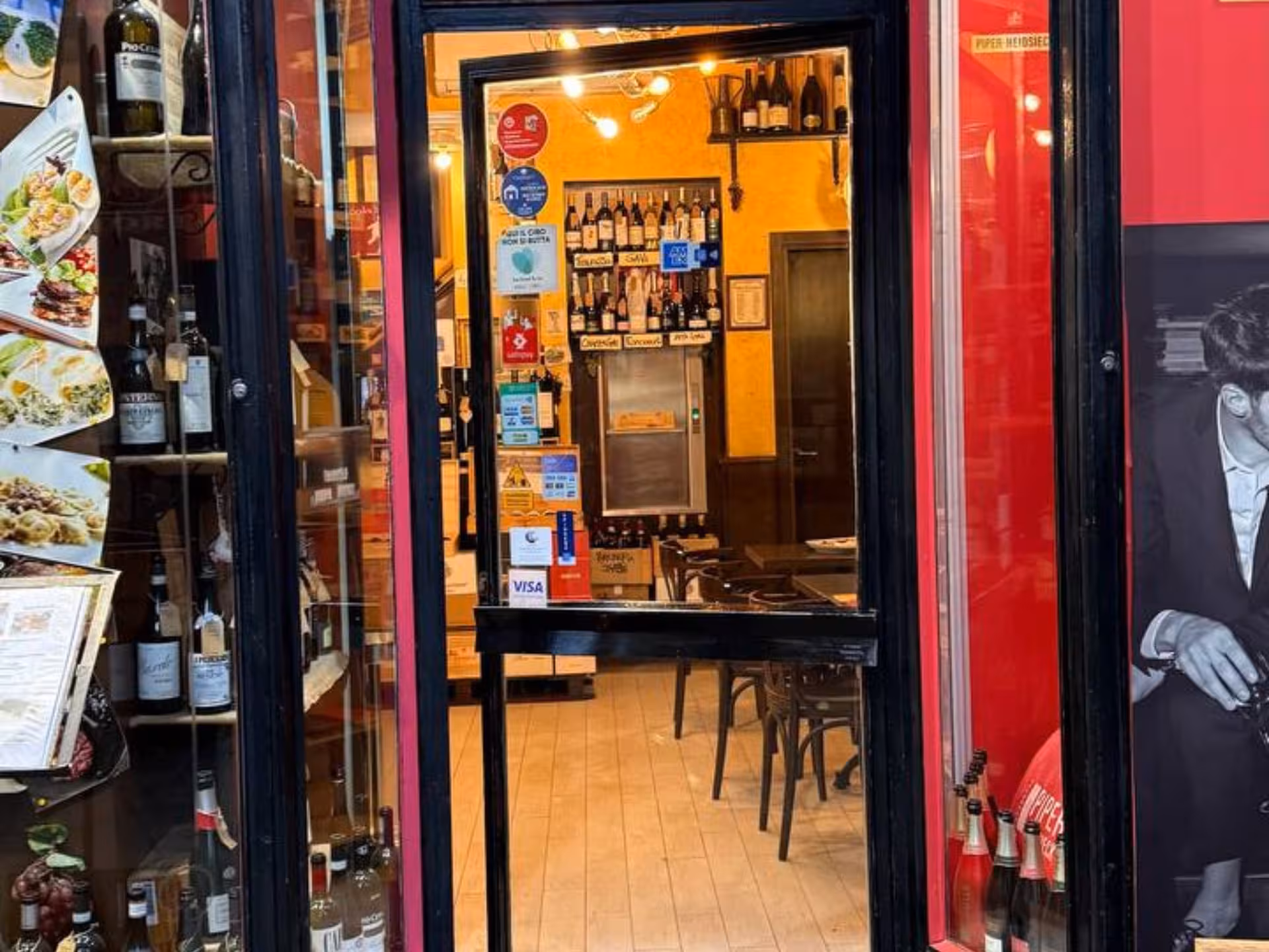 Entrance to a cozy Turin wine bar, perfect for Piedmontese tapas and wine tasting experience.