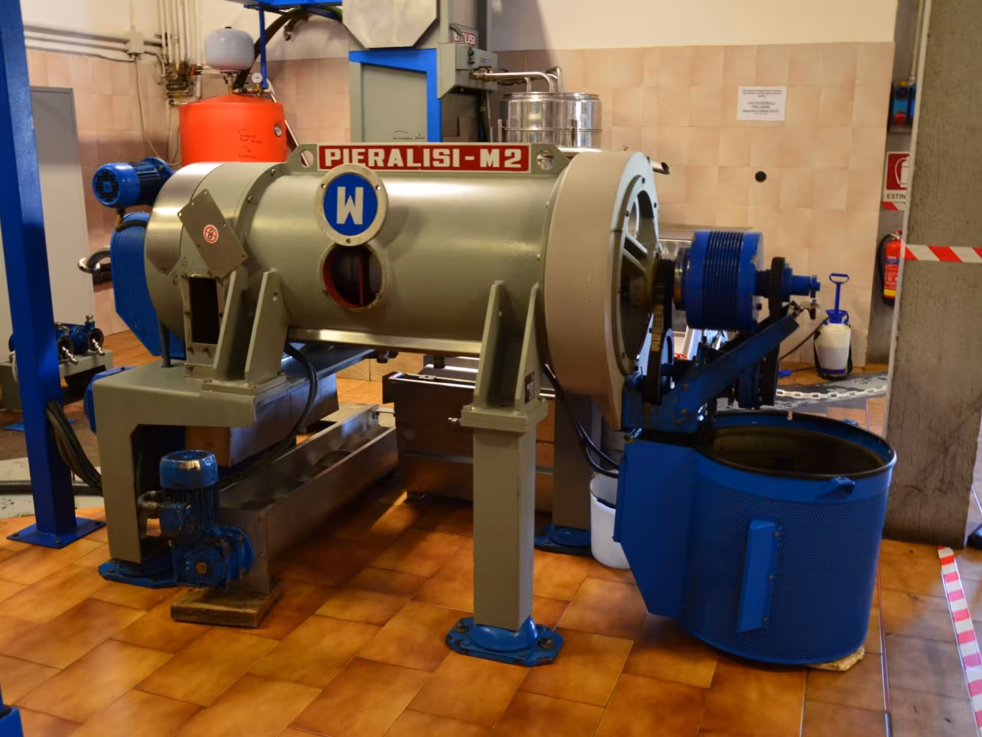 Industrial Pieralisi-M2 equipment for olive oil production in Chianciano, featuring efficient machinery for quality oil extraction.