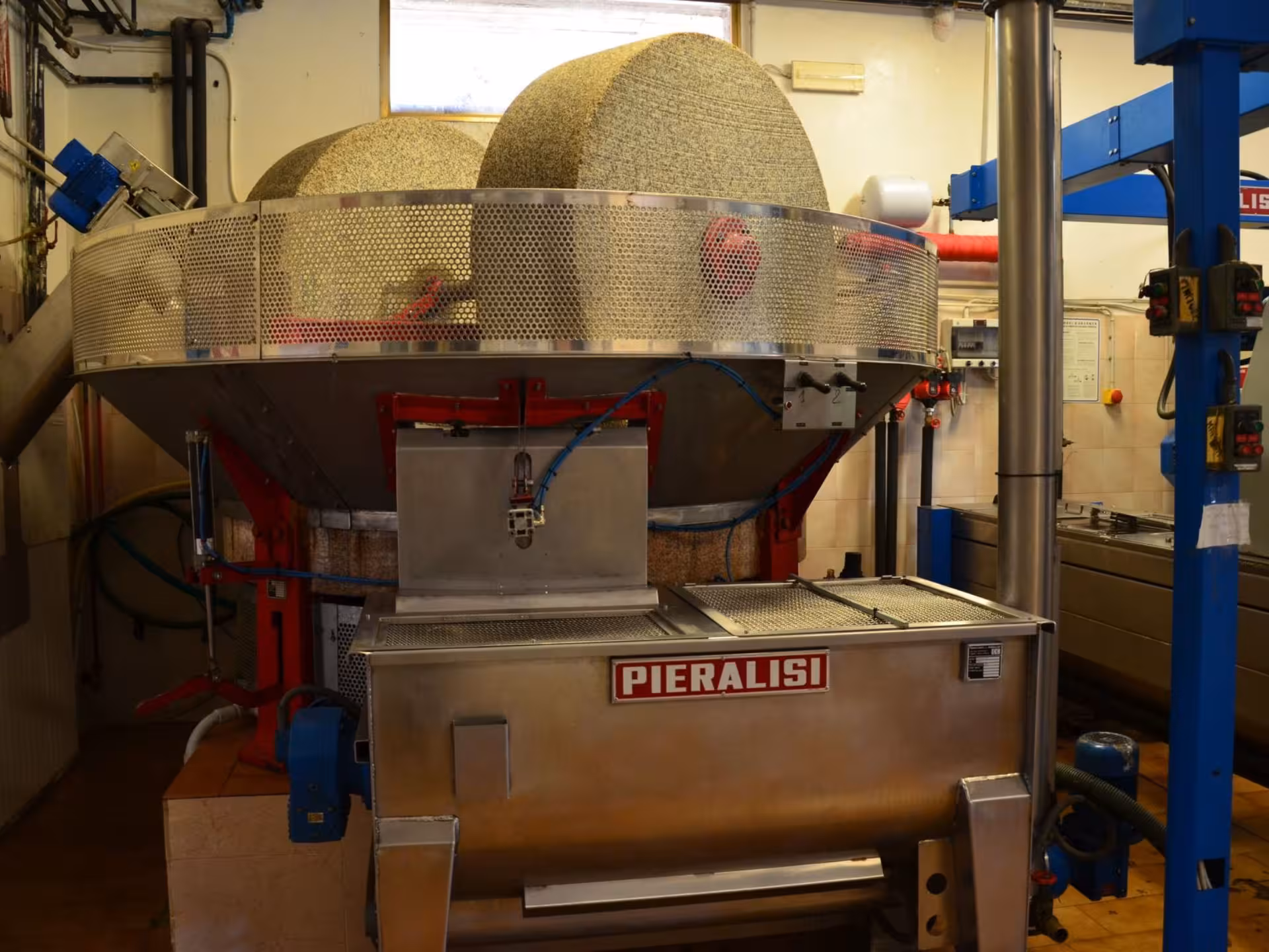 Modern Pieralisi olive oil extraction machinery in Chianciano, highlighting advanced techniques in oil pressing.