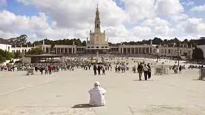 Pilgrims at the Sanctuary of Fátima, an iconic religious site and optional stop on the Lisbon to Porto customized transfer route.