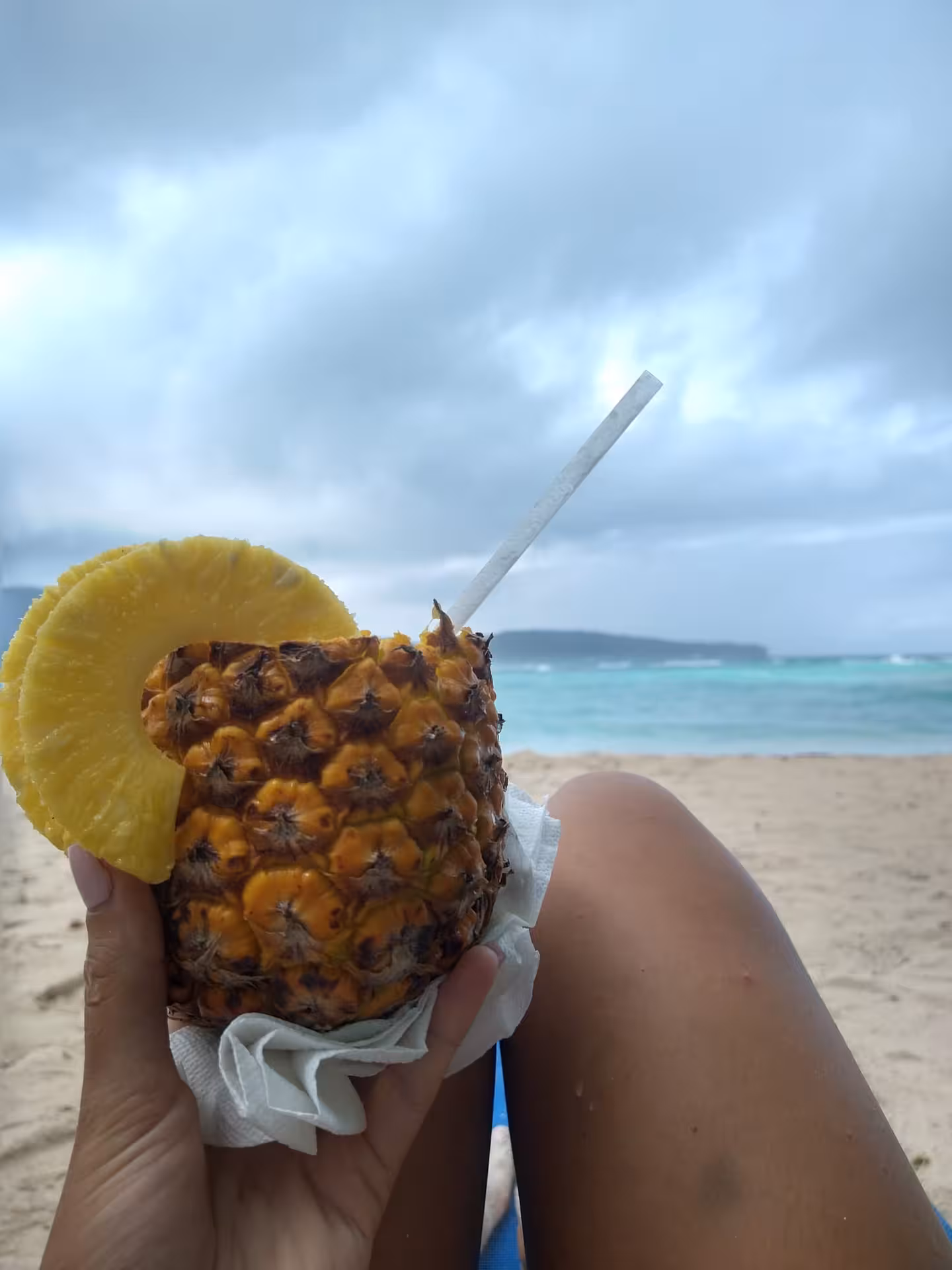 Fresh pineapple drink on a Dominican Republic beach, mindful seaside break on a 7-day self-discovery tour