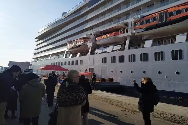 Passengers disembark at Piraeus cruise terminal, meeting point for private arrival transfer to Athens city center