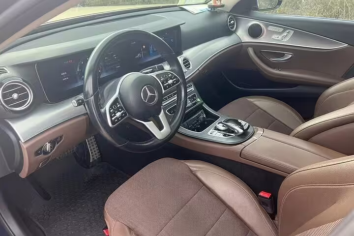 Modern luxury sedan cabin for Piraeus Port to Athens city center private arrival transfer with driver service