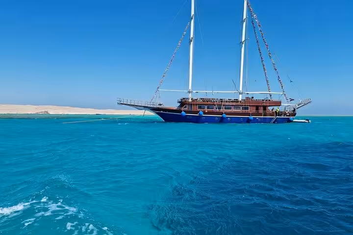 Pirates sailing boat in turquoise Red Sea on Ras Mohammed and White Island day trip from Sharm El Sheikh