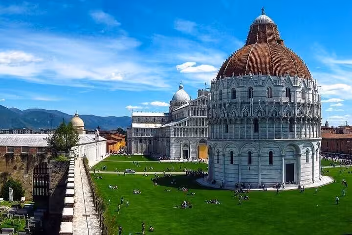 Explore Pisa's stunning Baptistery and Camposanto with vibrant green lawns on your full-day Lucca and Pisa tour.