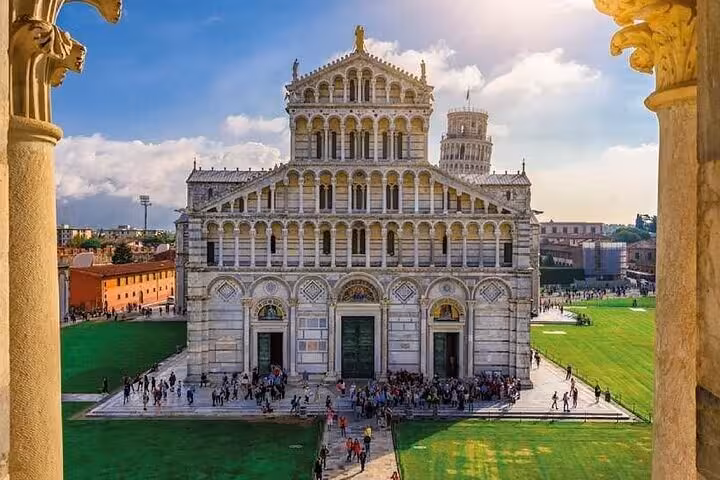 Stunning view of Pisa Cathedral with the Leaning Tower in the background, highlighted on a sunny day tour.