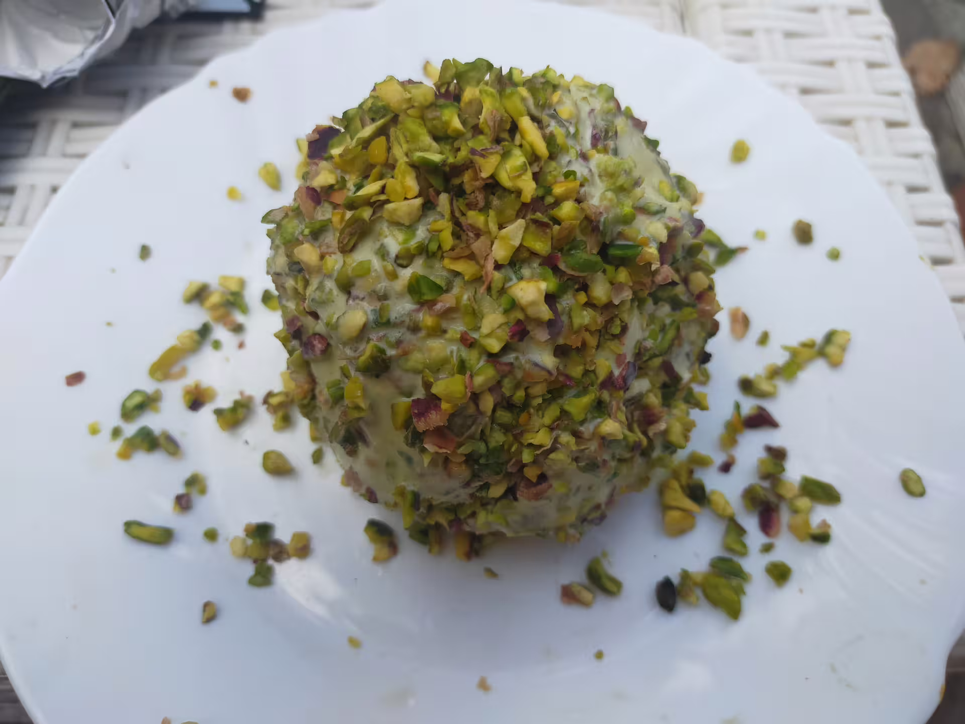 Traditional pistachio-covered gelato dessert served in Tropea, gourmet highlight of Costa degli Dei food tour
