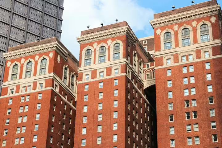 Historic red brick buildings with ornate arched windows in downtown Pittsburgh