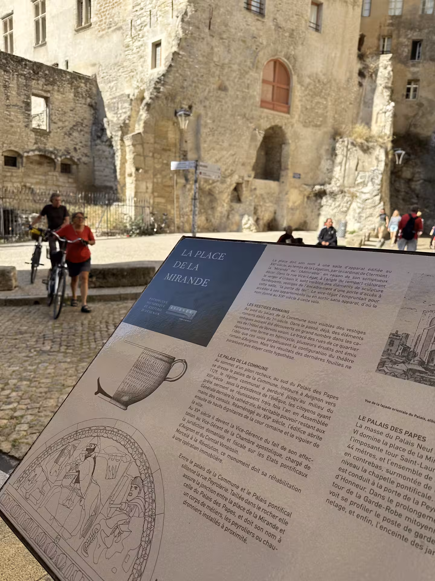Close-up of Place de la Mirande sign with old town streets, Avignon stop on private shore tour from Marseille
