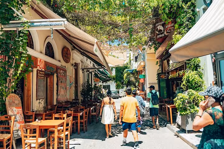 Plaka Athens alley with tavernas and greenery, small group walking and Greek food tasting tour for cruise guests
