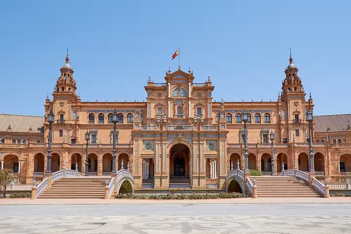 Marvel at the intricate details of Plaza de España's central building on your guided tour from Lisbon to Andalusia.