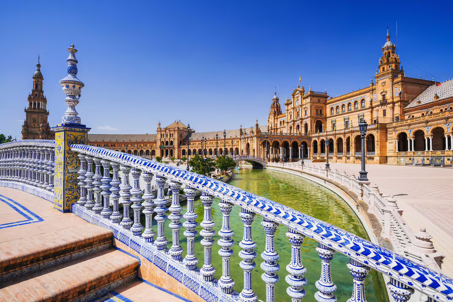 Ceramic bridge and canal at Plaza de España Seville, highlight of 1-day walking tour with audioguide in 7 languages