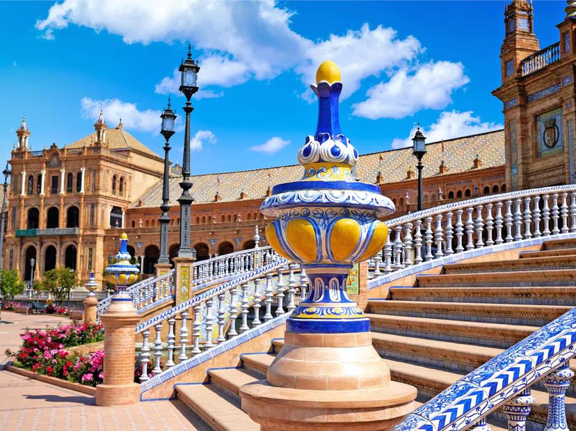 Marvel at the vibrant ceramic details of Plaza de España in Seville on the 4 Day Andalusia and Toledo Guided Tour.
