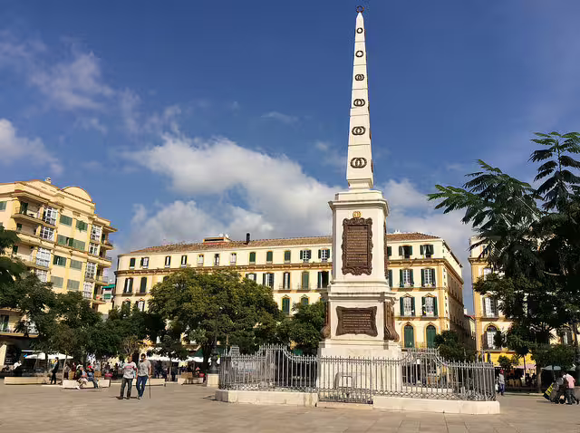 Plaza de la Merced obelisk monument in central Malaga, stop on a private Marbella to Malaga tour