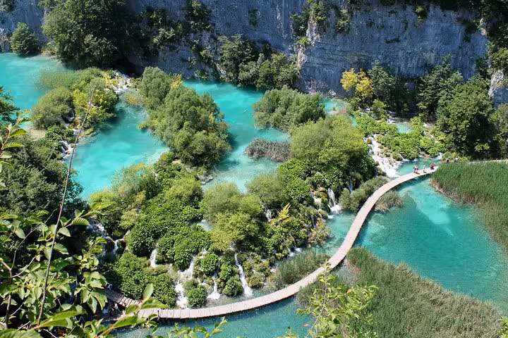 Plitvice Lakes National Park boardwalk over turquoise lagoons and waterfalls on 7-day Croatia private tour