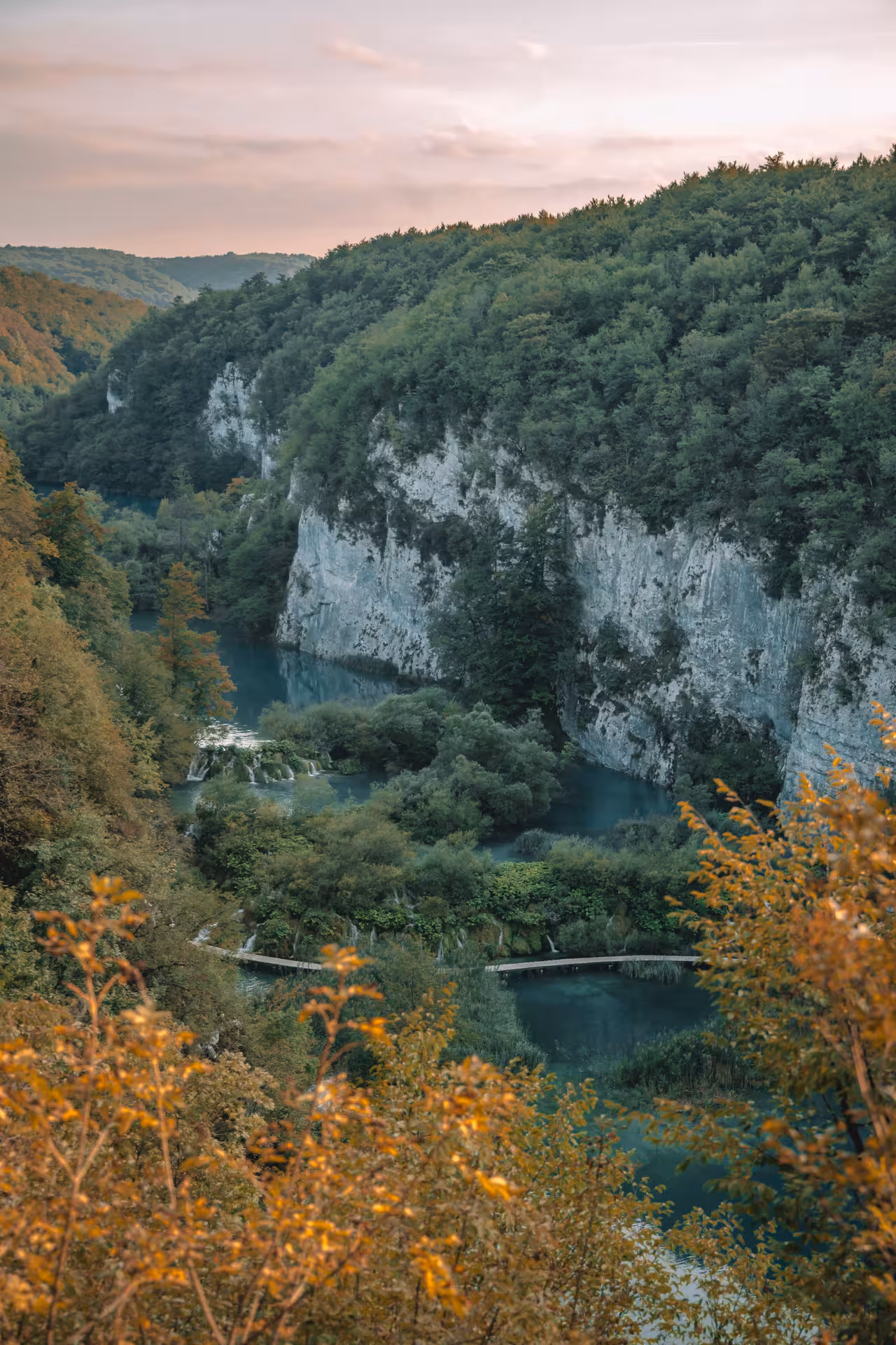 Clifftop viewpoint of Plitvice Lakes turquoise waters and waterfalls, hidden gems guided day tour from Zagreb