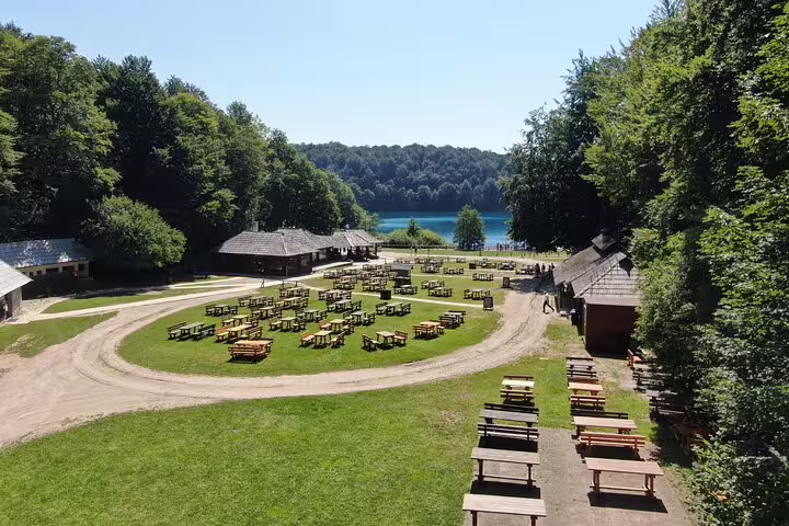Plitvice Lakes National Park entrance picnic area and wooden lodges by the lake, Croatia admission ticket