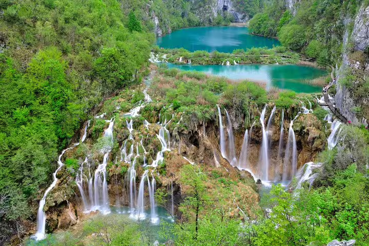 Panoramic Plitvice Lakes National Park waterfalls and turquoise lakes, Croatia, with boardwalk trail views
