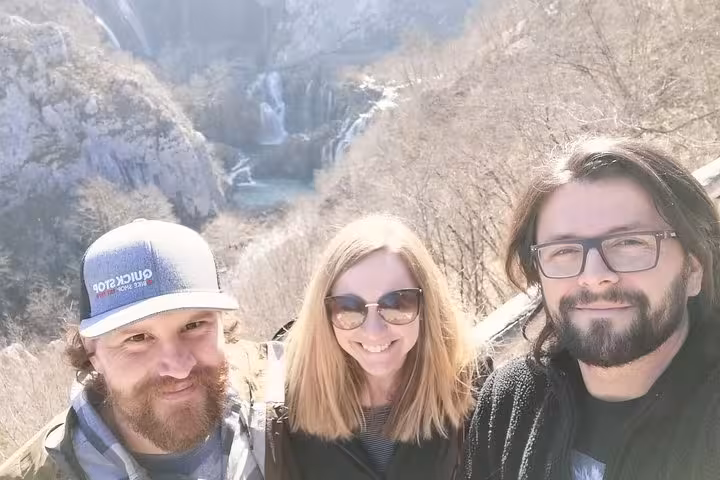 Travelers selfie at Plitvice Lakes National Park viewpoint on small group day tour from Zagreb, Croatia