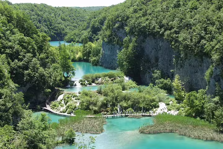 Panoramic view of Plitvice Lakes turquoise pools and waterfalls, a top day trip from Zadar and Biograd