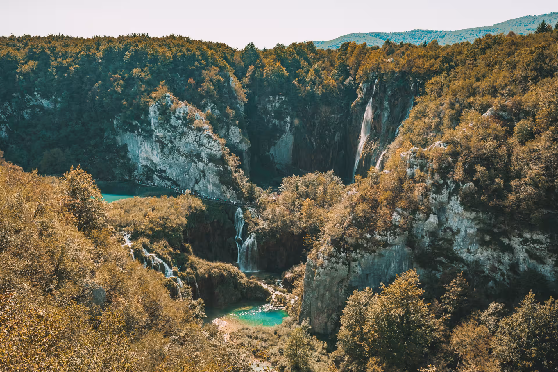 Panoramic Plitvice Lakes viewpoint with turquoise pools and waterfalls, hidden gems day trip from Zagreb