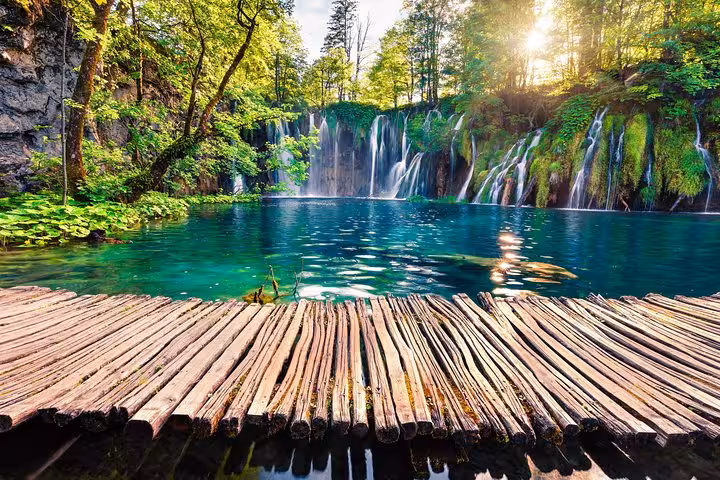 Plitvice Lakes National Park waterfalls and turquoise lake by wooden boardwalk on a 7-day private Croatia tour