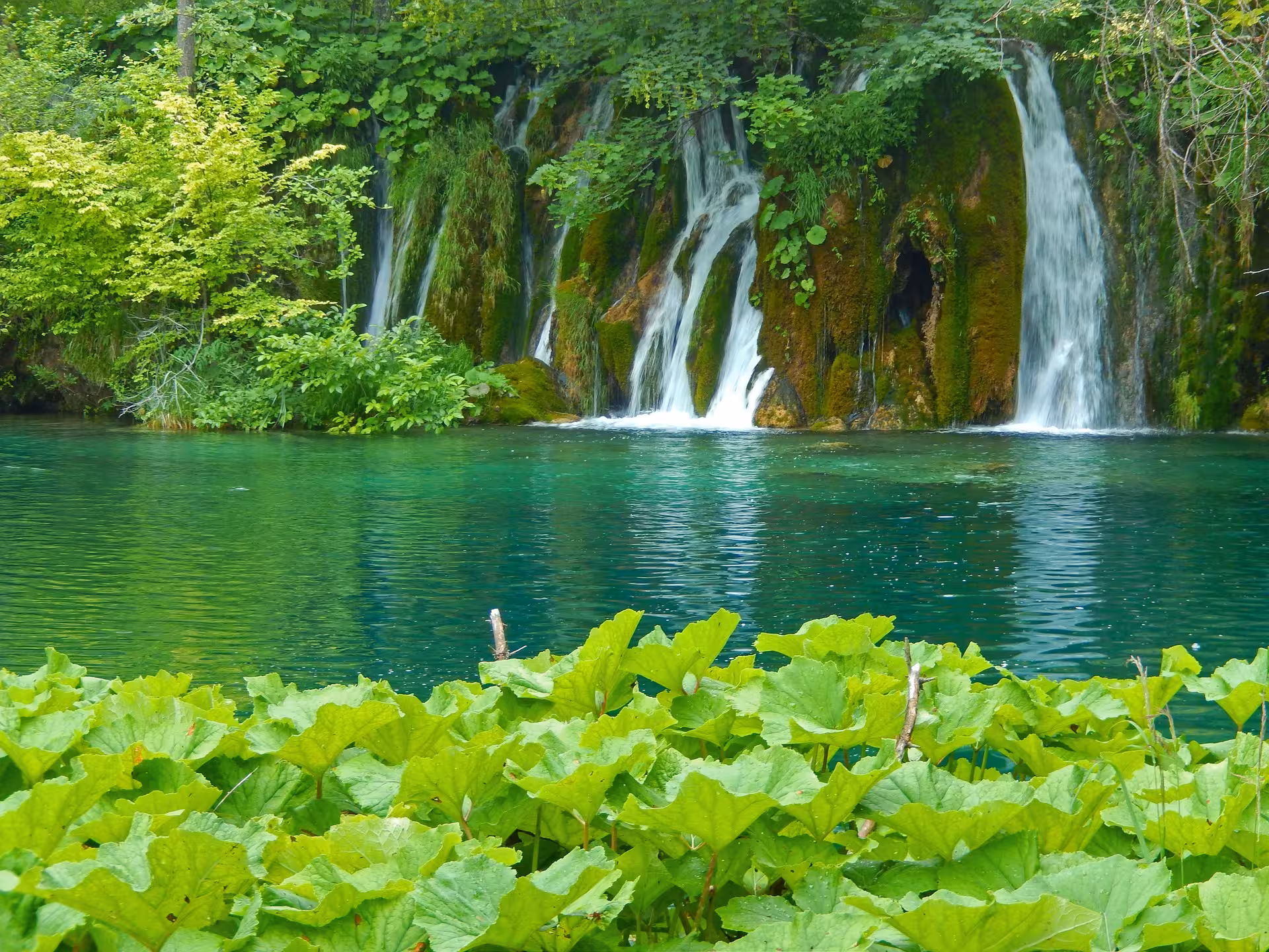 Waterfalls and emerald lake at Plitvice Lakes National Park on a day trip tour from Split, Croatia