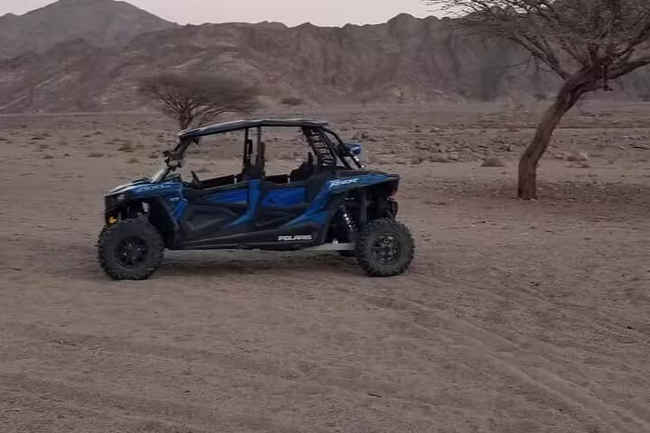 4-seat Polaris buggy parked in Sinai desert mountains on double buggy adventure safari from Sharm El Sheikh