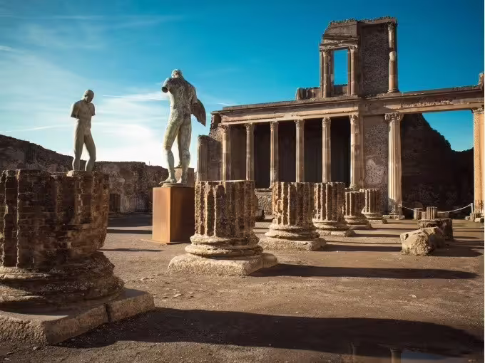 Pompeii archaeological ruins with columns and statues, guided VIP small-group tour from Amalfi Coast