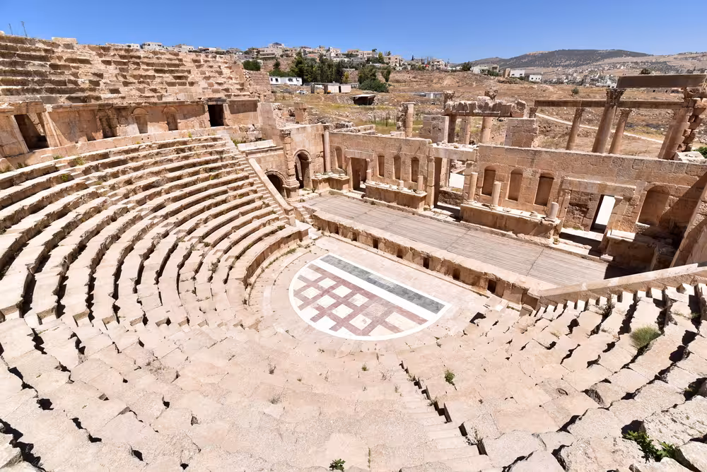 Ancient amphitheater in Pompeii, showcasing Roman architecture on the express prestige tour from Rome.