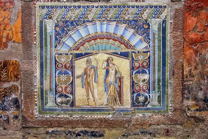 Intricate ancient mosaic in Pompeii showcasing vibrant colors and Roman artistry on a full-day tour with lunch included.