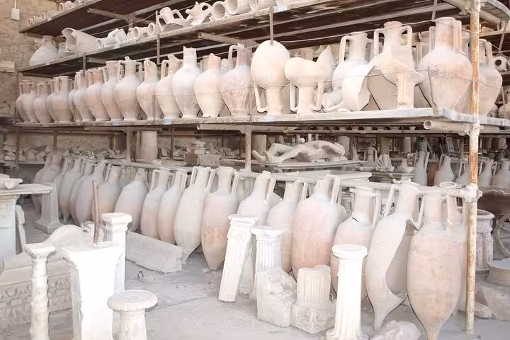 View ancient pottery artifacts at Pompeii, perfectly preserved for centuries, on a fascinating skip-the-line tour.