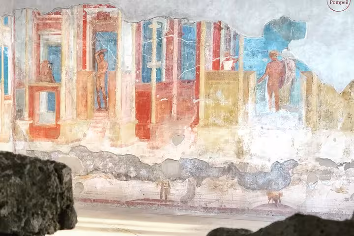 Colorful fresco in Pompeii showcasing ancient Roman art, a highlight of the Vesuvius and Pompeii small group tour.