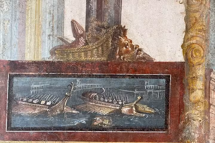 Detailed fresco depicting ancient Roman ships in Pompeii, highlighting maritime history and artistic heritage.