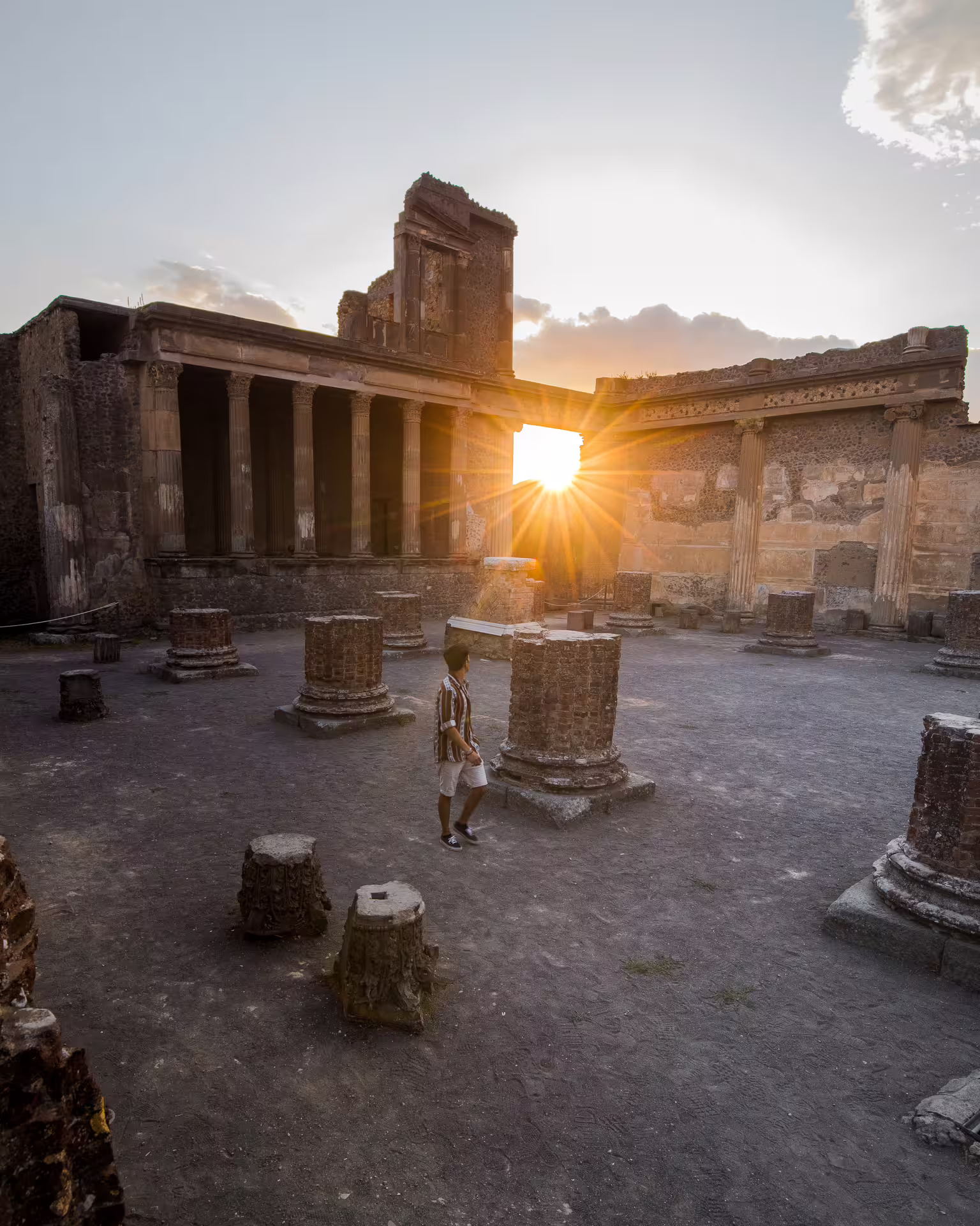 Sunset over Pompeii archaeological site courtyard, a highlight of Naples to Pompeii group tour