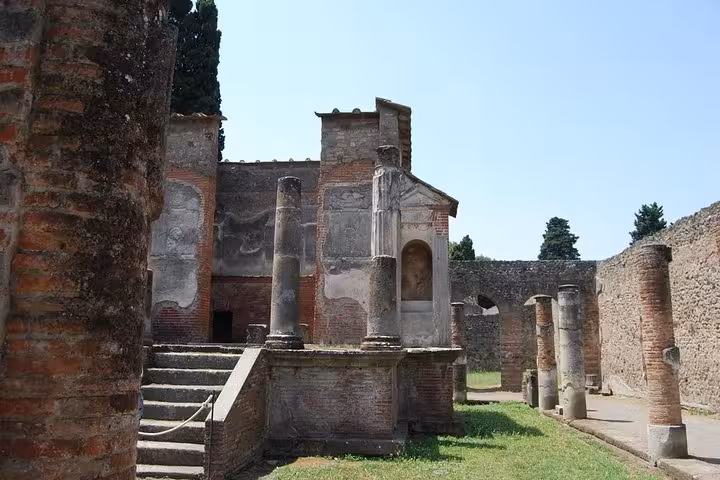 Well-preserved columns and structures in Pompeii, ideal for history enthusiasts on the Naples private shore excursion.