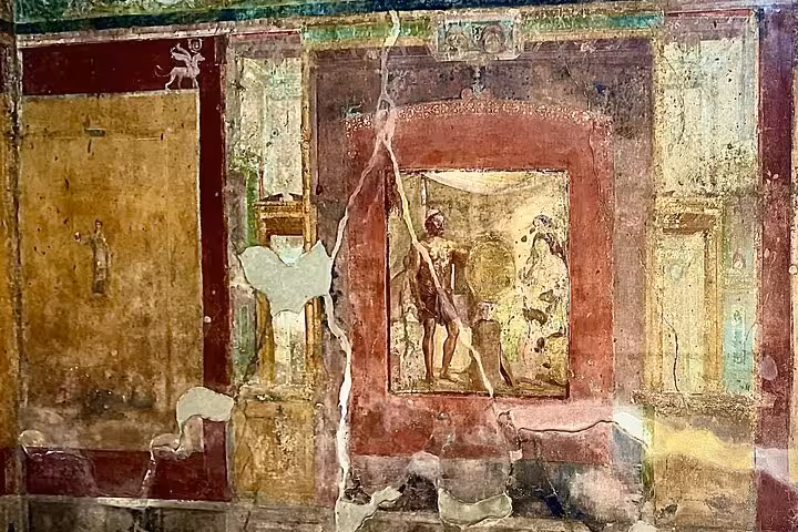 Admire vivid Pompeii frescoes depicting ancient life on a guided skip-the-line tour from Naples.