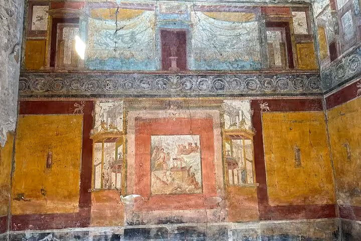 Explore vibrant frescoes on the Pompeii Skip-the-Line Entry Small Group Guided Tour, showcasing ancient Roman art.
