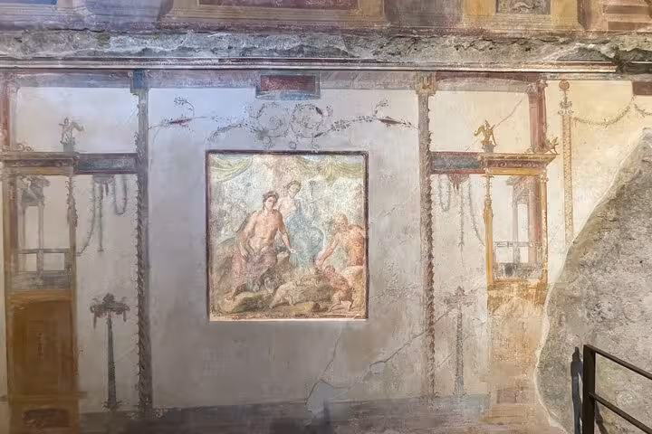 Admire detailed frescoes depicting mythological scenes in Pompeii, highlighting artistry preserved through centuries.