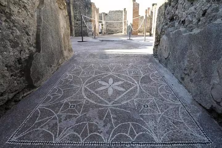 Geometric mosaic floor in Pompeii alleyway, affordable Pompeii & Herculaneum from Naples low cost guided visit
