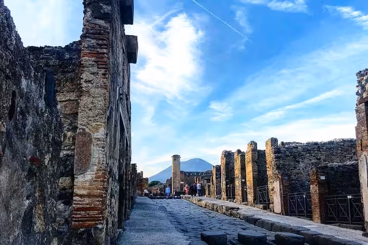 Stroll through the historic streets of Pompeii with stunning views of Mount Vesuvius on an exclusive guided tour.