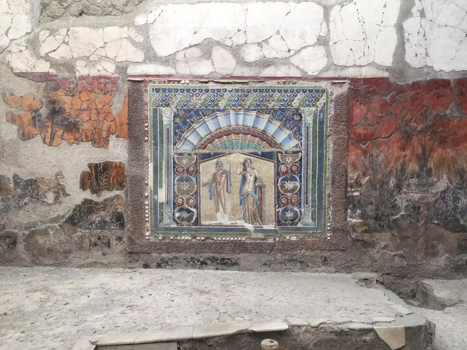 Pompeii fresco wall painting in a Roman villa, highlight of Pompeii and Herculaneum group tour from Naples