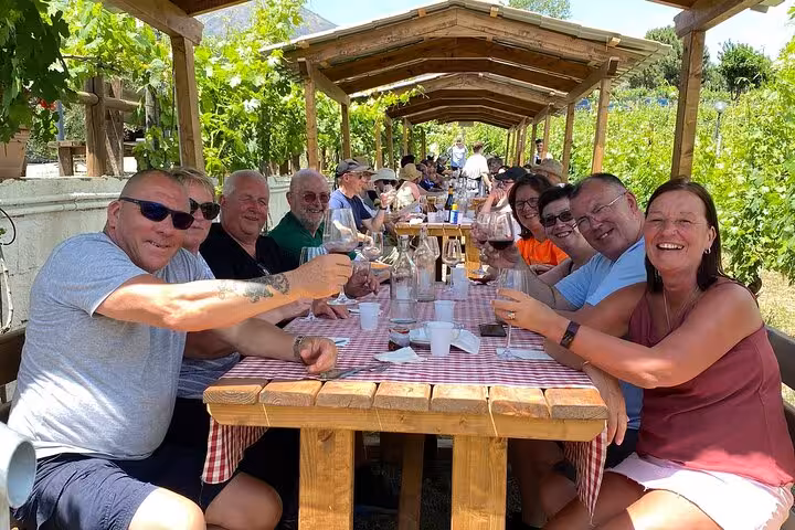 Enjoy a delightful vineyard lunch with fellow travelers on a guided tour of Pompeii and Herculaneum, featuring local flavors.