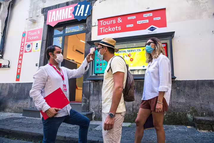 Tourists undergo temperature checks at a ticket office for the Skip The Line Pompeii Guided Tour from Sorrento.