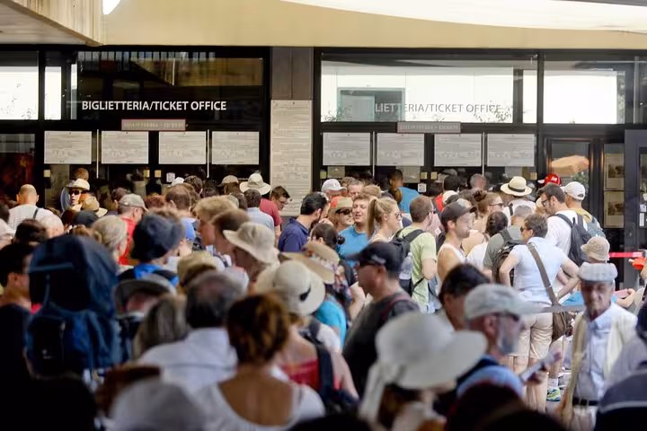 Visitors gather eagerly at the ticket office for the Pompeii and Mt. Vesuvius semi-private tour from Positano.