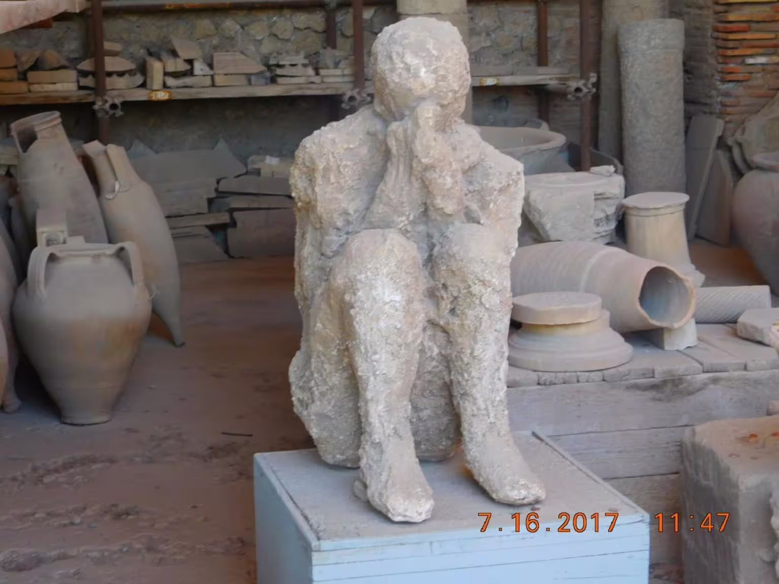 Plaster cast of Pompeii victim in storage area, highlight of Pompeii & Amalfi Coast group tour from Naples