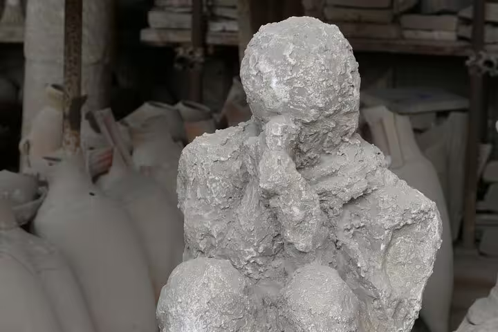 Pompeii plaster cast victim in ash, seen on VIP small-group tour from Naples with skip-the-line ticket