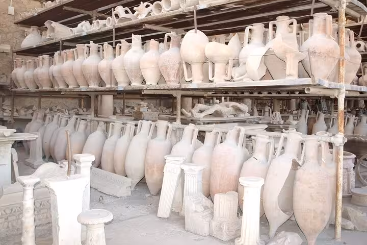 Ancient clay amphorae displayed in Pompeii, capturing the rich history of Roman artifacts and excavation sites.