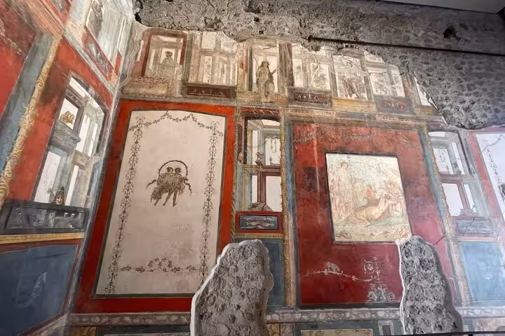 Admire detailed Roman frescoes and architectural remnants on a Pompeii tour departing from the Amalfi Coast.